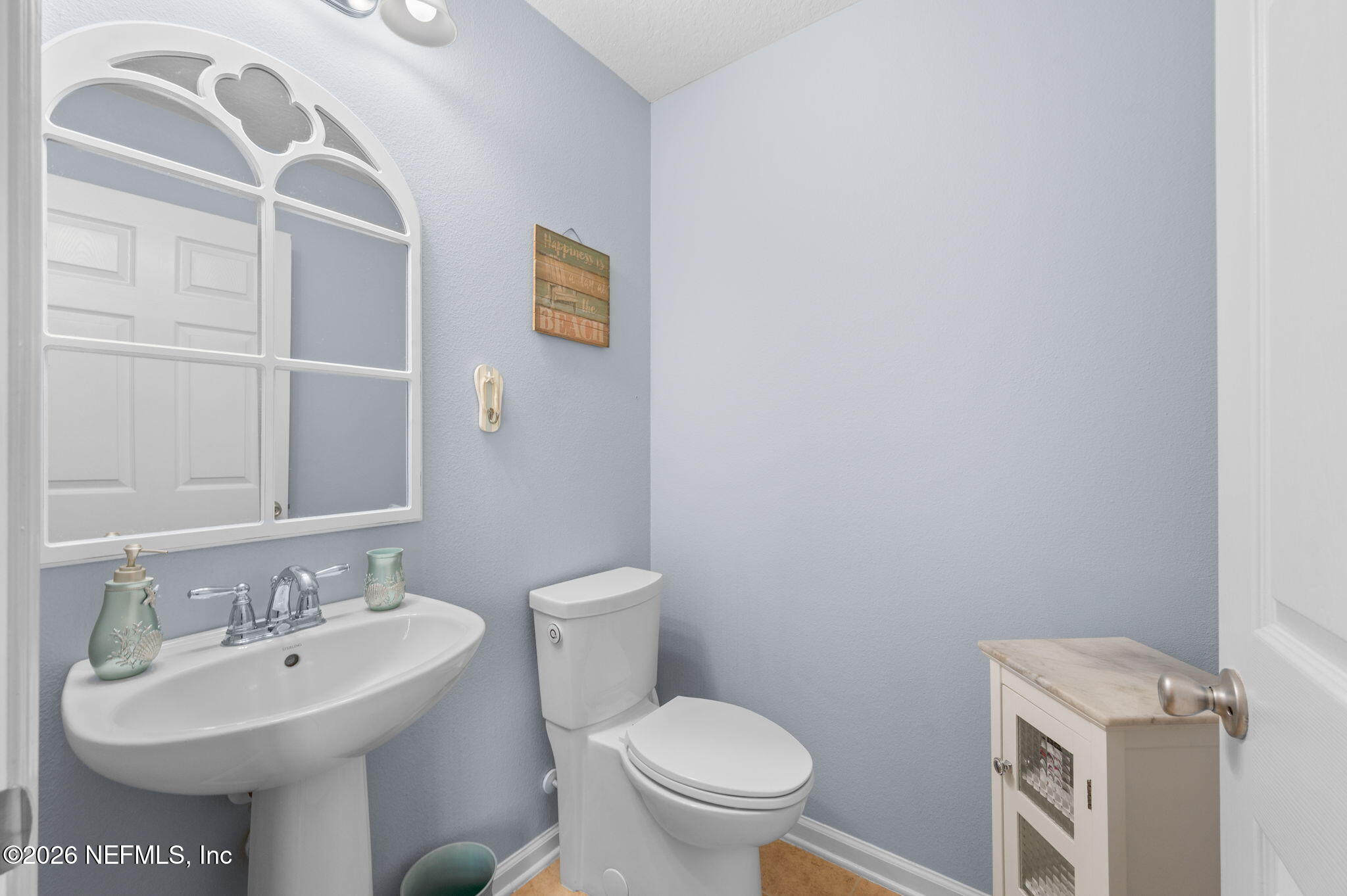 12 Islander Court St. Augustine, FL 32080 - Photo 53 of 53 a bathroom with a sink a toilet and mirror