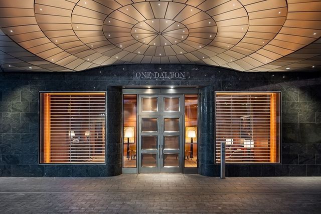a dining room with furniture and window