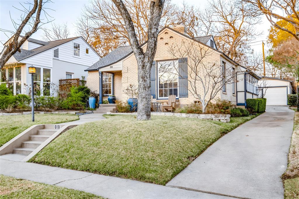 818 Valencia Street Dallas, TX 75223 - Photo 1 of 38 a view of a white house with a large tree