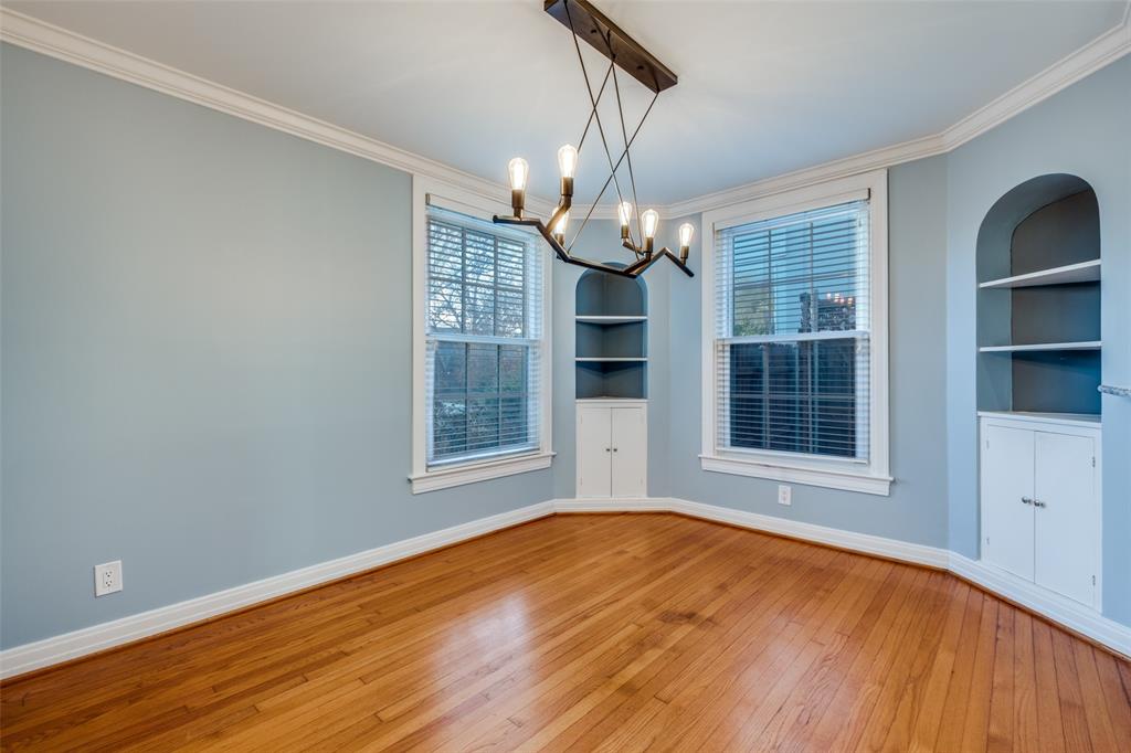 818 Valencia Street Dallas, TX 75223 - Photo 13 of 38 a view of an empty room with wooden floor and a window