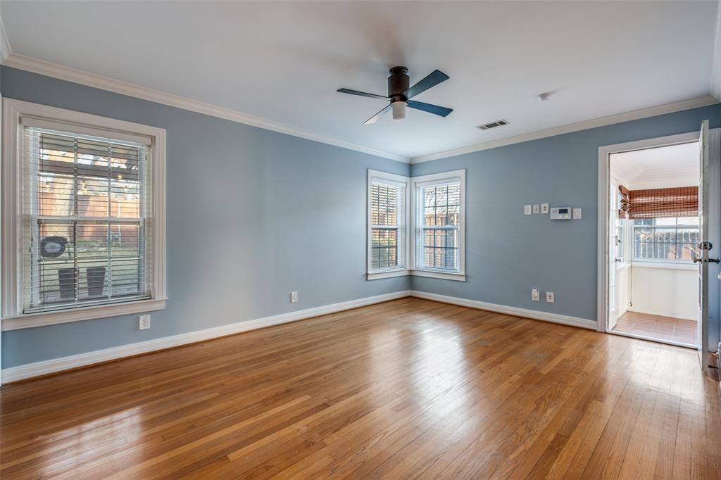818 Valencia Street Dallas, TX 75223 - Photo 22 of 38 a view of an empty room with wooden floor and a window