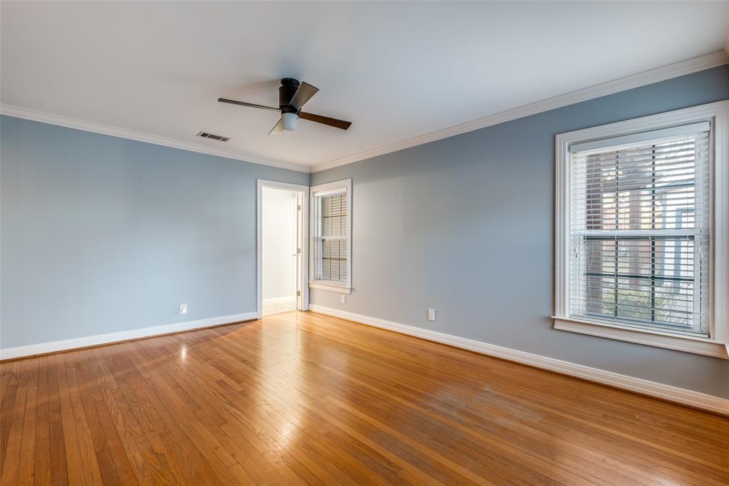 818 Valencia Street Dallas, TX 75223 - Photo 24 of 38 a view of an empty room with wooden floor and a window