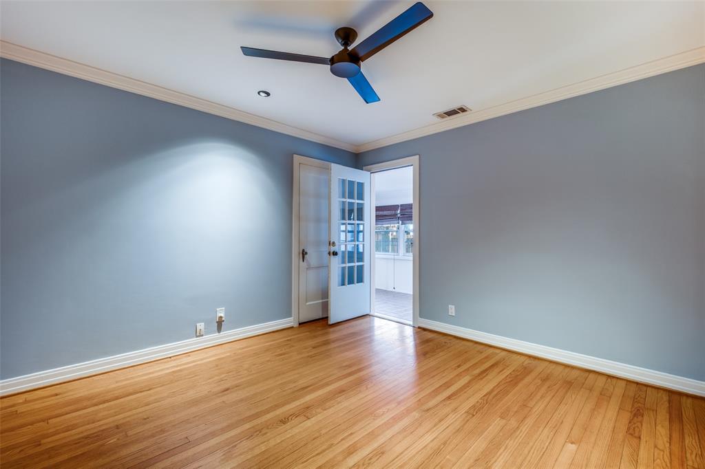 818 Valencia Street Dallas, TX 75223 - Photo 28 of 38 an empty room with wooden floor and windows
