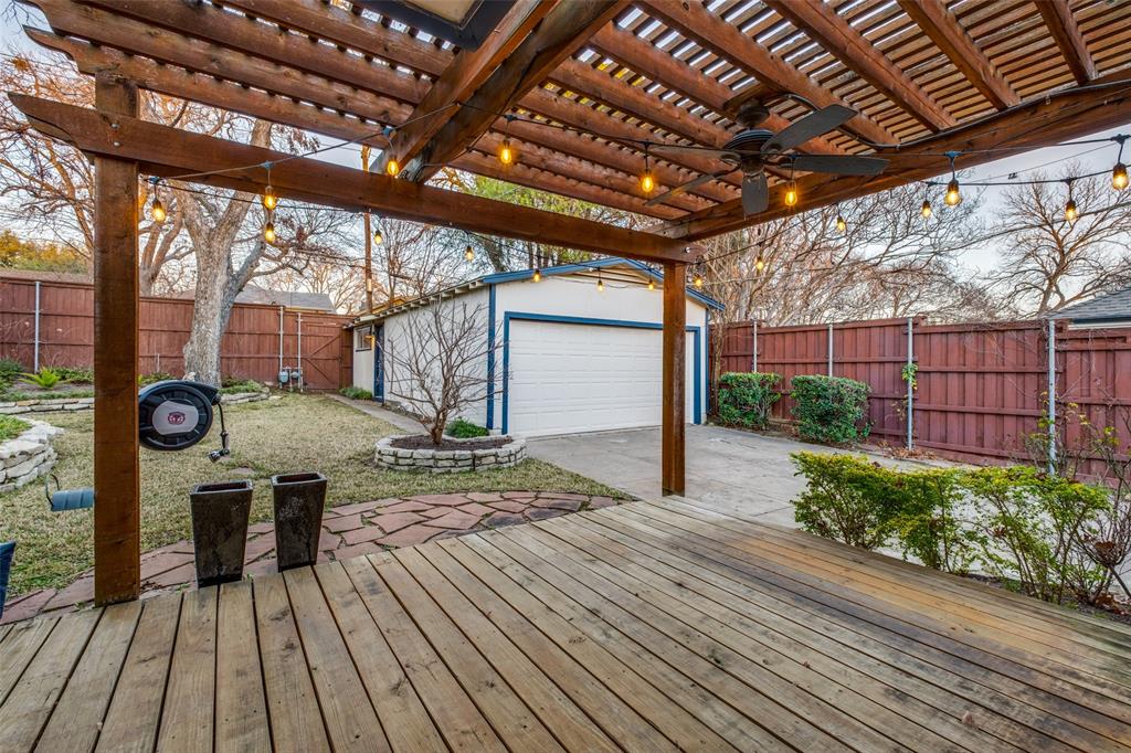 818 Valencia Street Dallas, TX 75223 - Photo 35 of 38 a view of a backyard with wooden floor