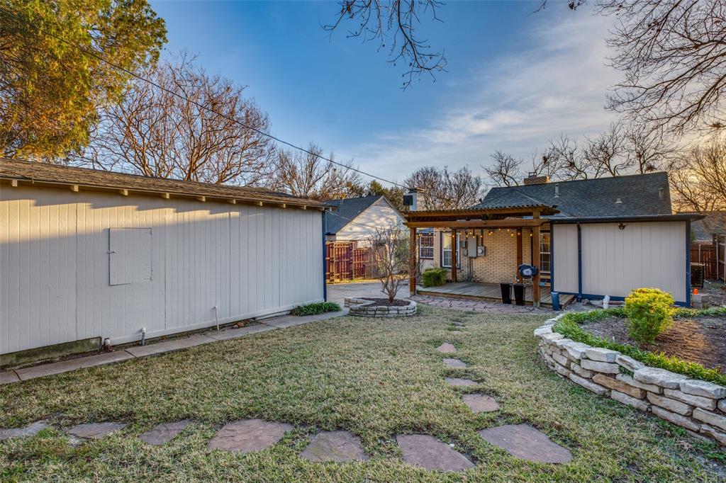 818 Valencia Street Dallas, TX 75223 - Photo 37 of 38 a backyard of a house with seating space