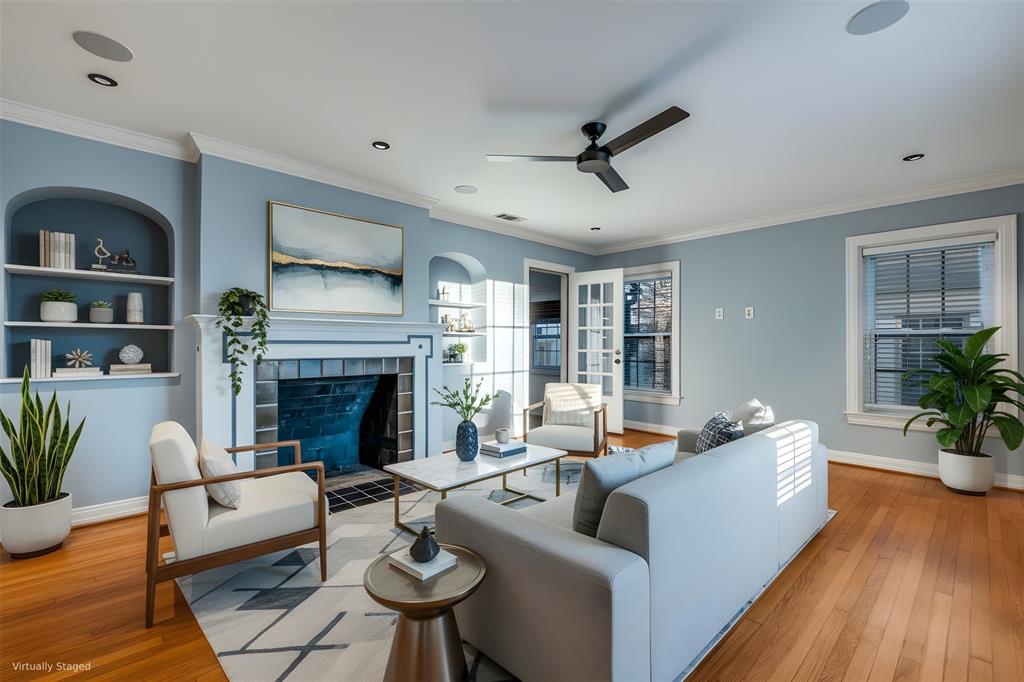 818 Valencia Street Dallas, TX 75223 - Photo 5 of 38 a living room with furniture fireplace and potted plants