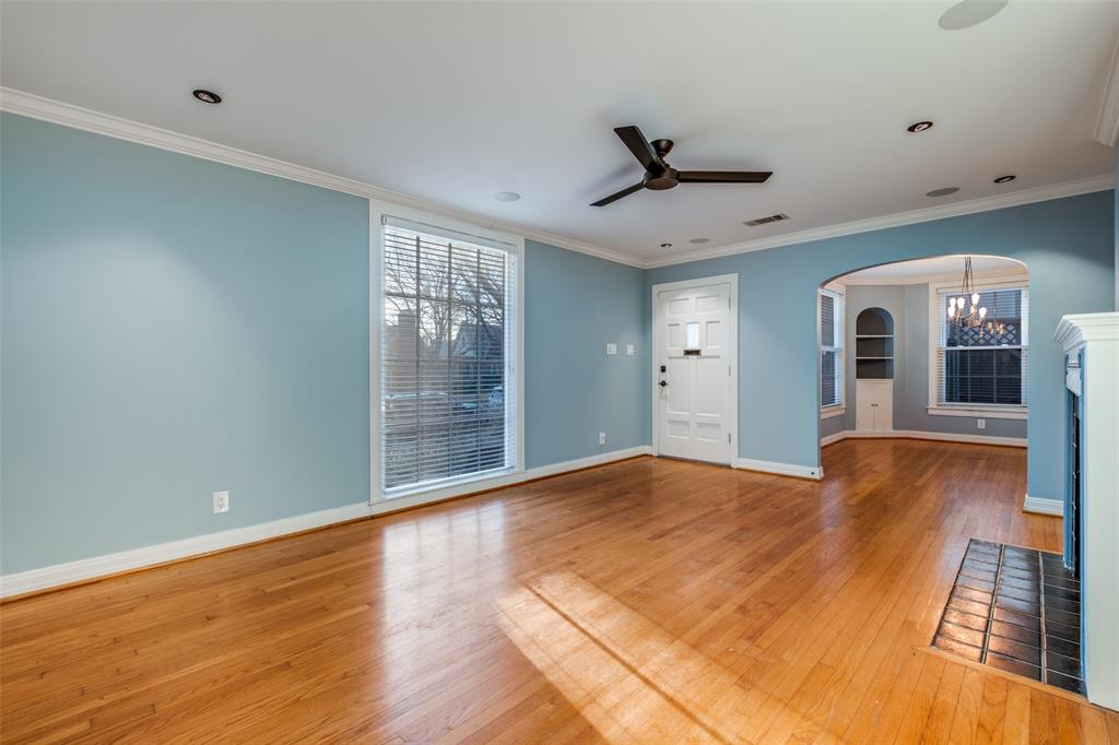 818 Valencia Street Dallas, TX 75223 - Photo 6 of 38 a view of empty room with wooden floor and fan