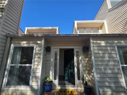 a front view of a house with glass windows