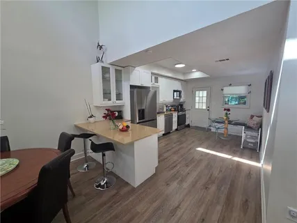 a living room with furniture and a table