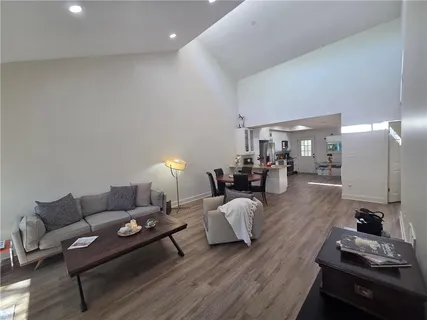 a living room with furniture and a table