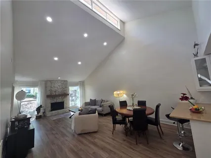a living room with fireplace furniture and a wooden floor