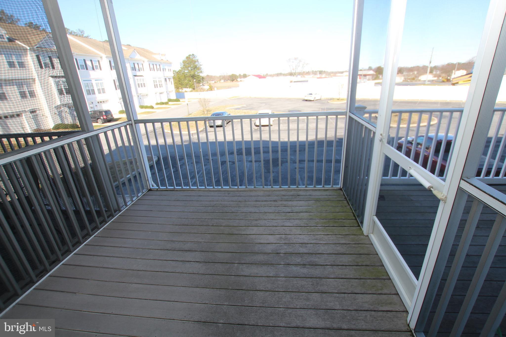 35385 Winthrop Court, Unit B162 Millsboro, DE 19966 - Photo 11 of 18 a view of wooden balcony with outdoor seating