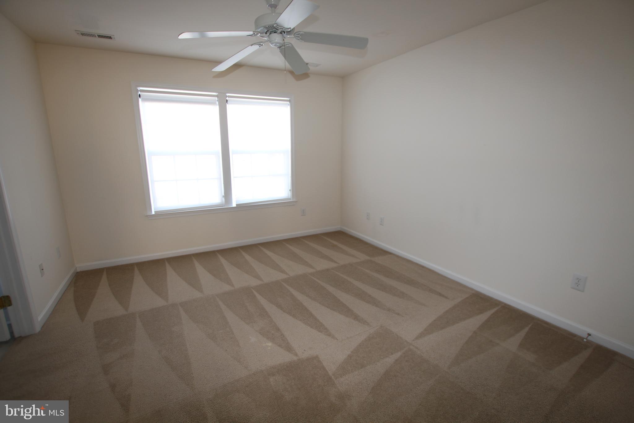 35385 Winthrop Court, Unit B162 Millsboro, DE 19966 - Photo 12 of 18 an empty room with a window