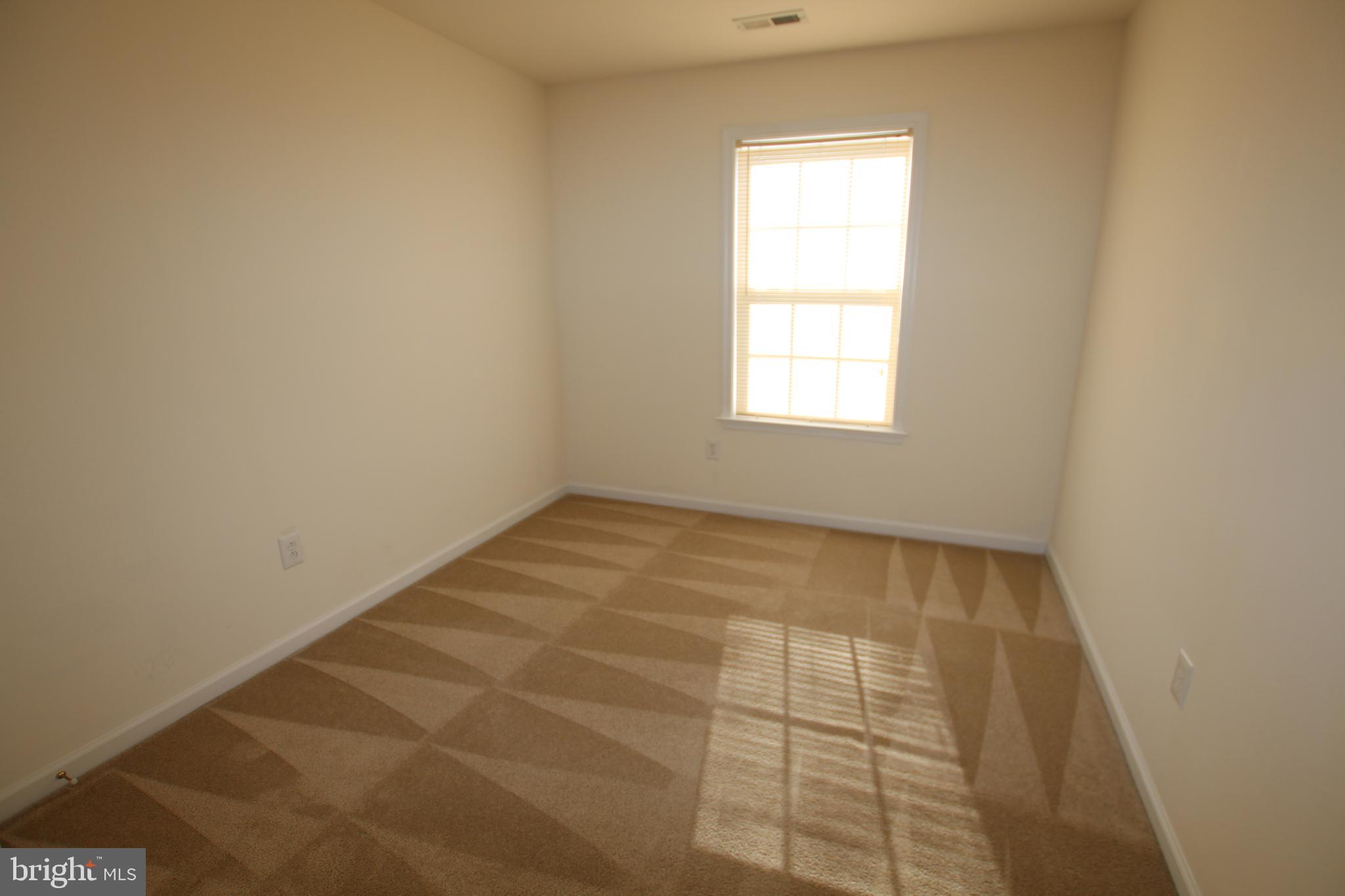 35385 Winthrop Court, Unit B162 Millsboro, DE 19966 - Photo 18 of 18 an empty room with a window