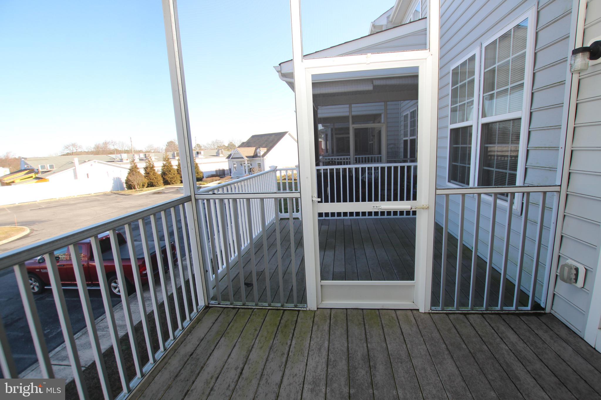 35385 Winthrop Court, Unit B162 Millsboro, DE 19966 - Photo 10 of 18 a view of balcony with wooden floor