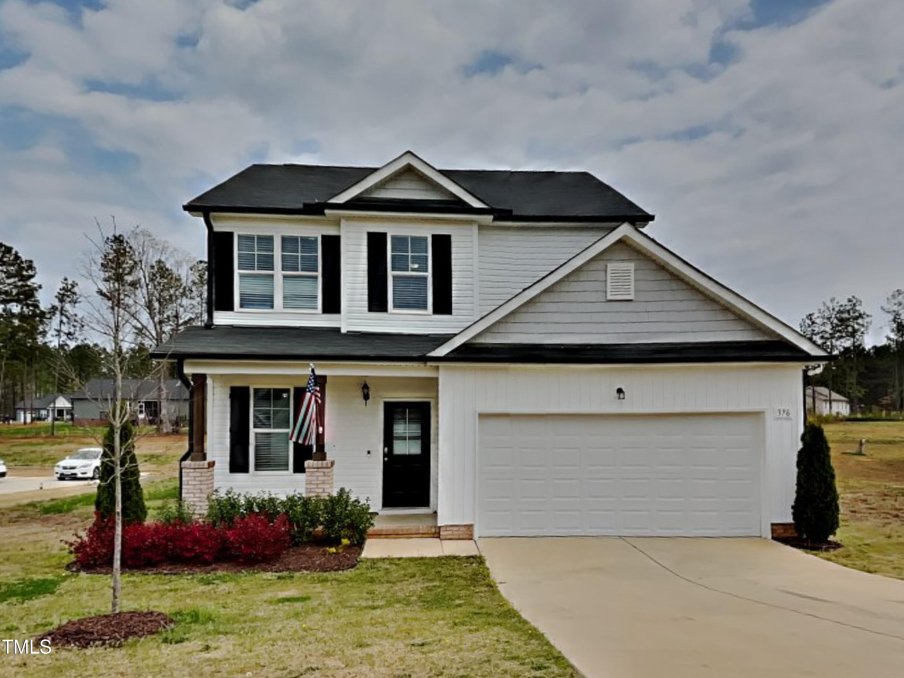376 Olde Place Drive Zebulon, NC 27597 - Photo 1 of 16 a front view of a house with a yard