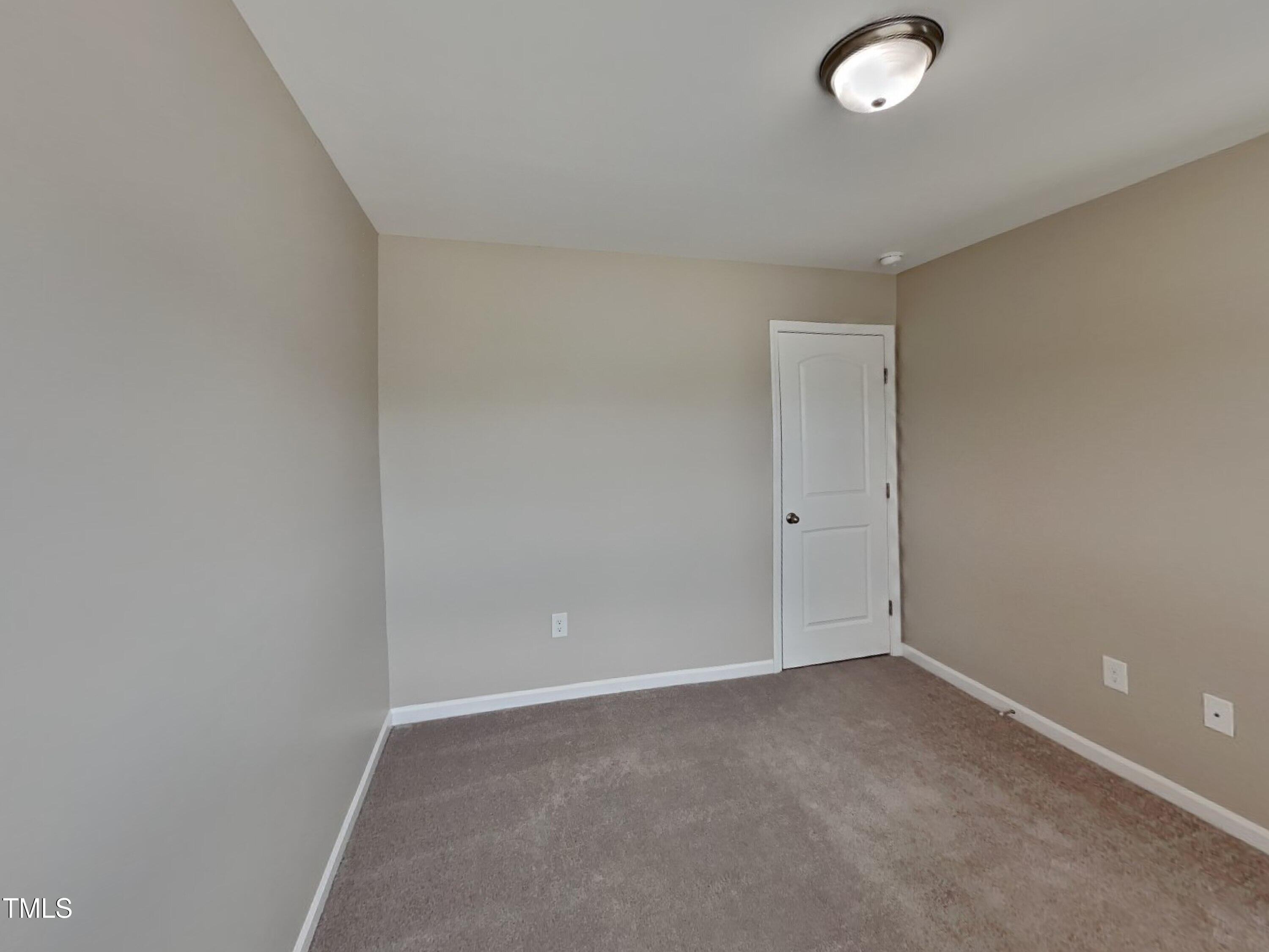 376 Olde Place Drive Zebulon, NC 27597 - Photo 13 of 16 a view of an empty room