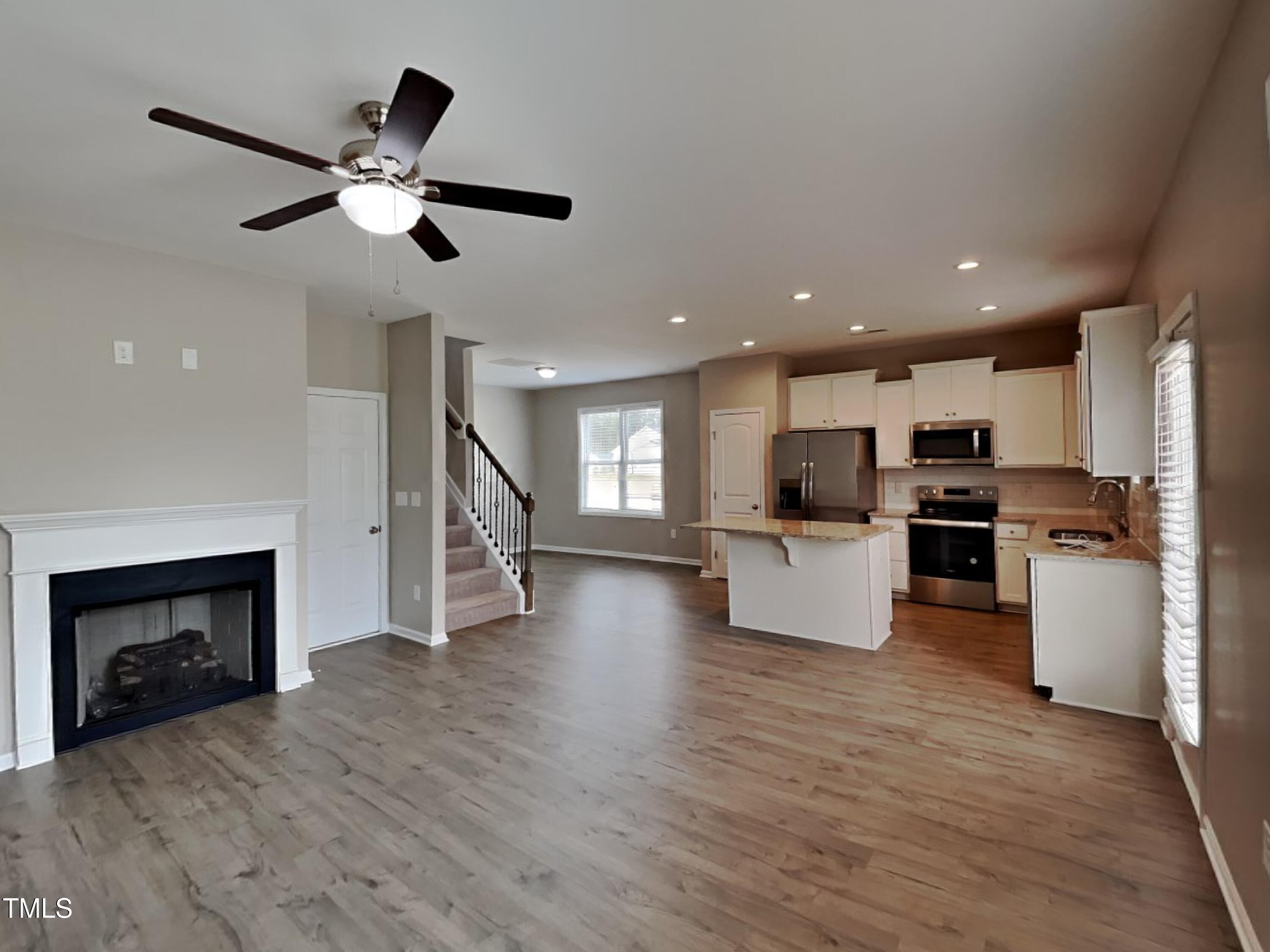376 Olde Place Drive Zebulon, NC 27597 - Photo 3 of 16 a view of living room with furniture and a fireplace