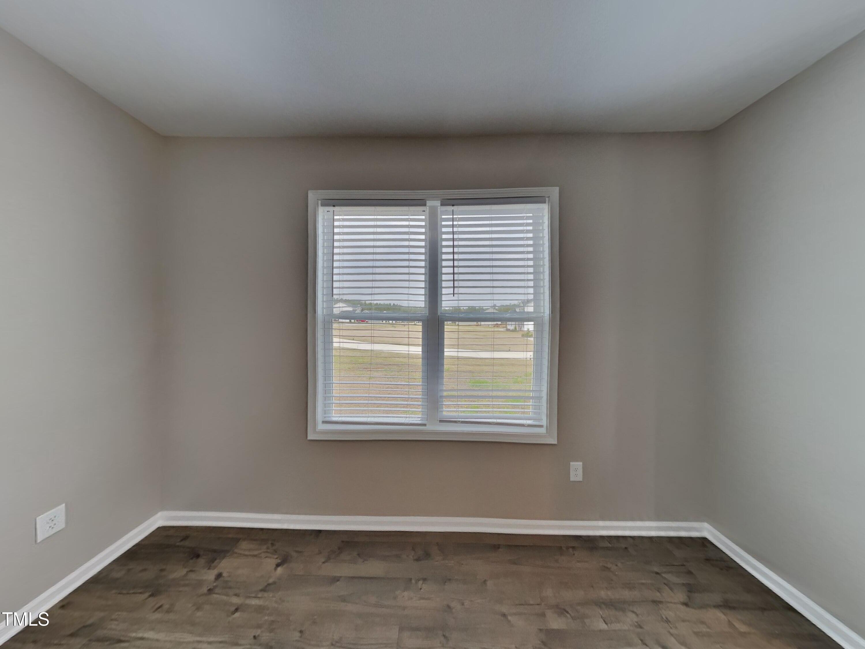 376 Olde Place Drive Zebulon, NC 27597 - Photo 4 of 16 an empty room with a window