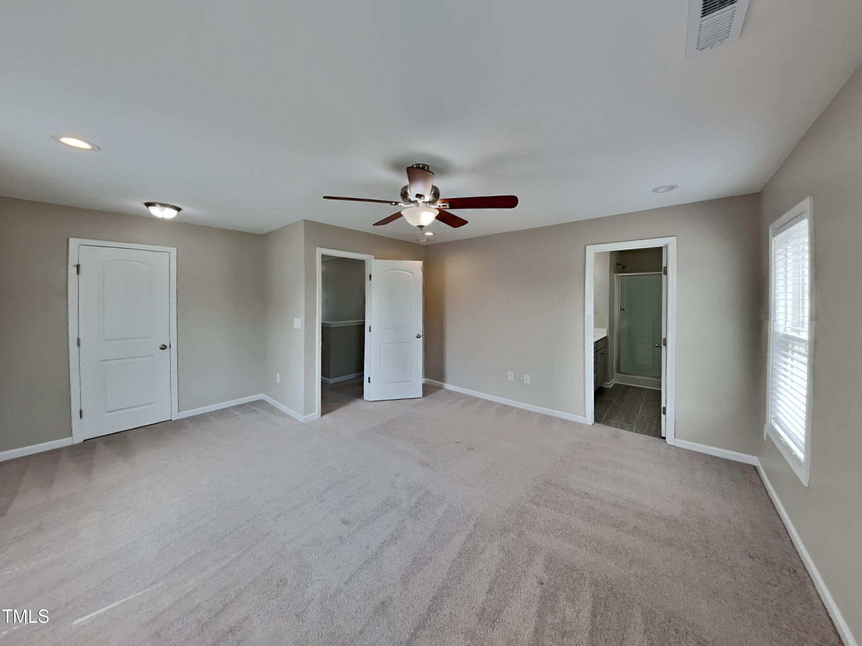 376 Olde Place Drive Zebulon, NC 27597 - Photo 7 of 16 a view of a livingroom with a ceiling fan and window