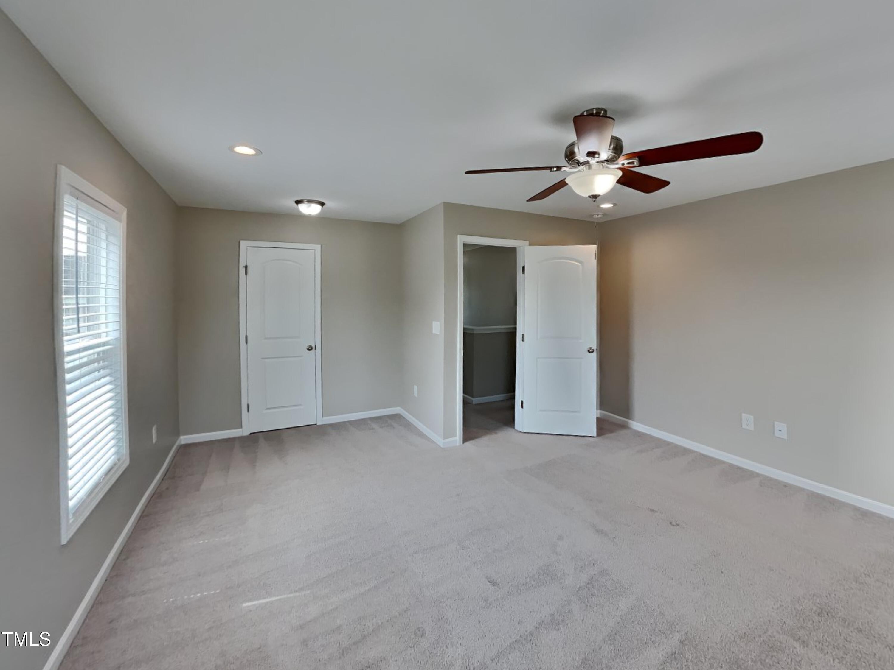 376 Olde Place Drive Zebulon, NC 27597 - Photo 8 of 16 a view of an empty room with a window