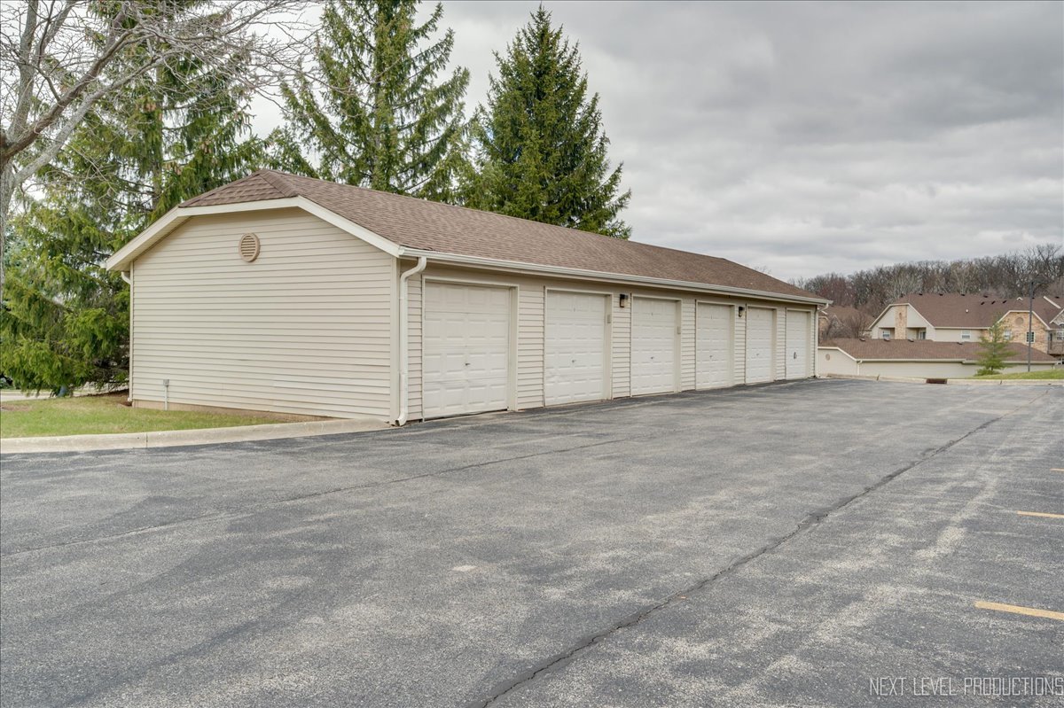 1506 Spring Brook Court, Unit 2A Round Lake Beach, IL 60073 - Photo 5 of 13 a view of backyard of house