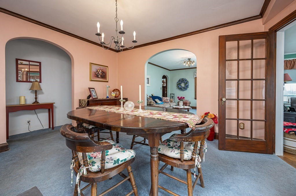 271 Beverly Road Worcester, MA 01605 - Photo 8 of 22 a view of a dining room with furniture and a chandelier
