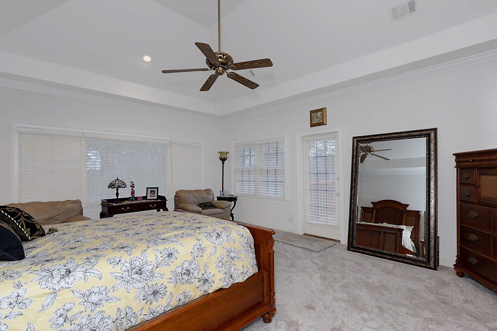 7633 Grand Ridge Road Columbus, GA 31904 - Photo 14 of 61 a bedroom with a bed and a walk in closet