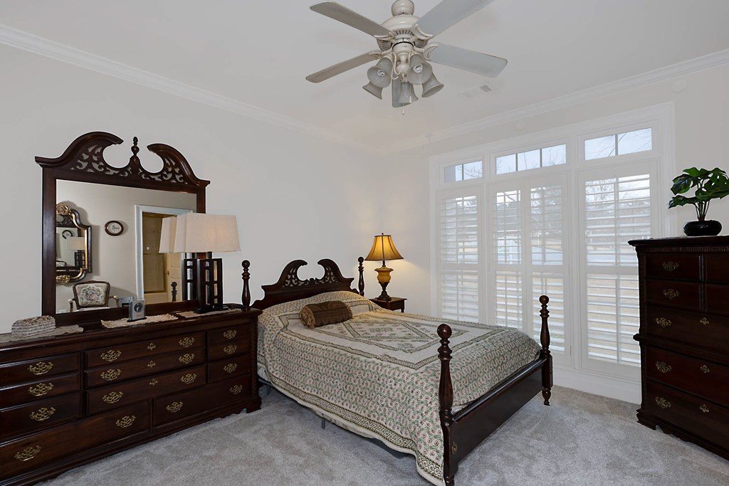 7633 Grand Ridge Road Columbus, GA 31904 - Photo 20 of 61 a bedroom with a bed and a mirror on the dresser