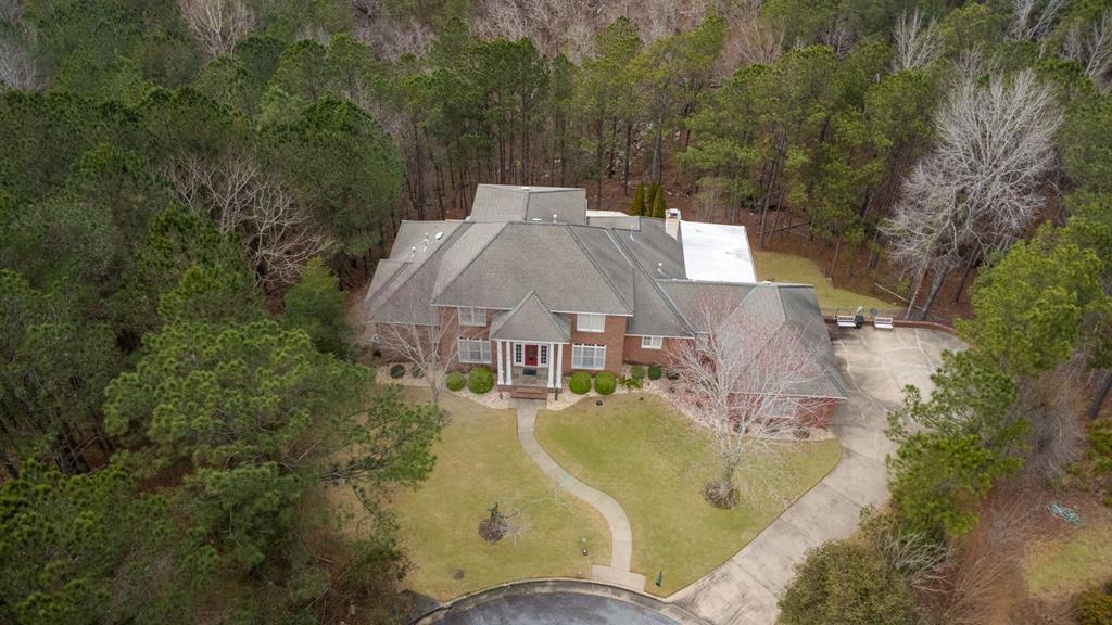 7633 Grand Ridge Road Columbus, GA 31904 - Photo 2 of 61 an aerial view of a house with swimming pool and large trees