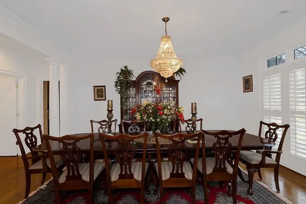 a view of entryway with wooden floor and door
