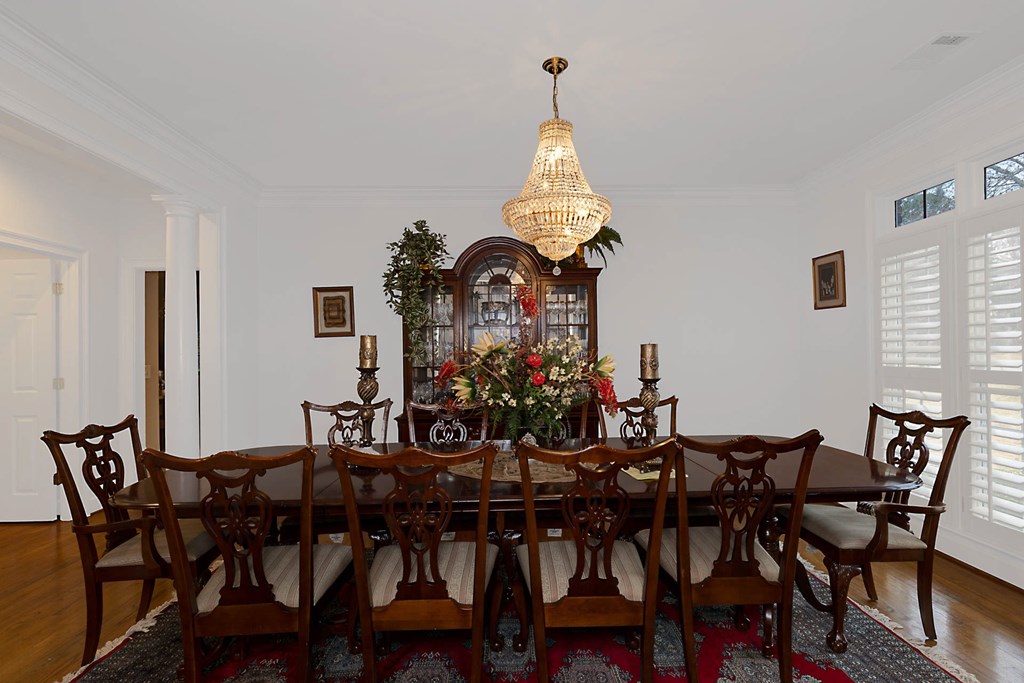 7633 Grand Ridge Road Columbus, GA 31904 - Photo 24 of 61 a view of a dining room with furniture and chandelier