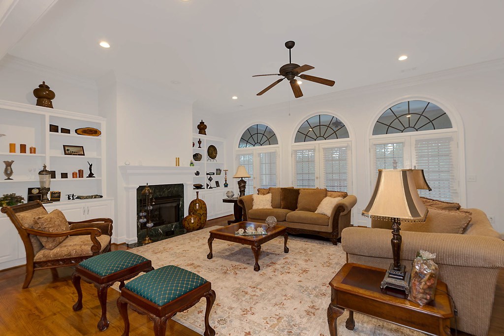 7633 Grand Ridge Road Columbus, GA 31904 - Photo 26 of 61 a living room with furniture fireplace and flat screen tv