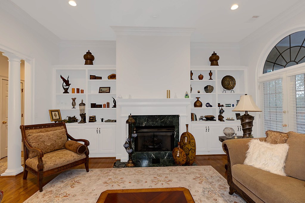 7633 Grand Ridge Road Columbus, GA 31904 - Photo 27 of 61 a living room with furniture and a fireplace