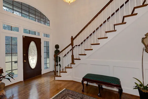 a view of a dining room with furniture and chandelier