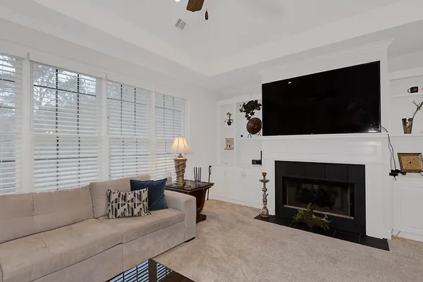 a bedroom with a large bed and a flat screen tv