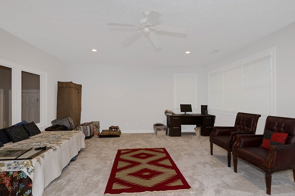 7633 Grand Ridge Road Columbus, GA 31904 - Photo 47 of 61 a living room with furniture and a rug