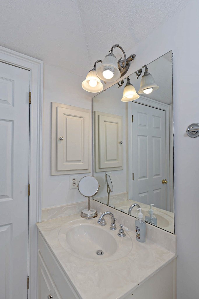 7633 Grand Ridge Road Columbus, GA 31904 - Photo 53 of 61 a bathroom with a sink and a mirror