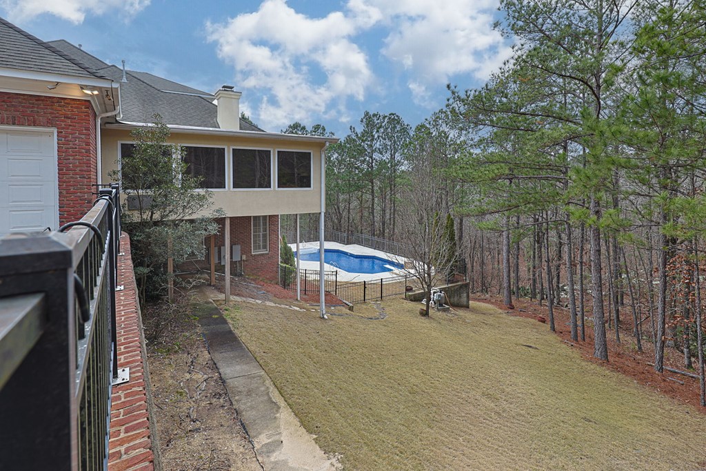 7633 Grand Ridge Road Columbus, GA 31904 - Photo 55 of 61 a backyard with table and chairs and a barbeque