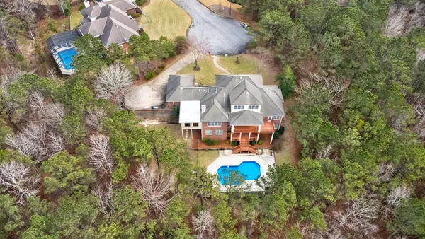 an aerial view of a house with outdoor space
