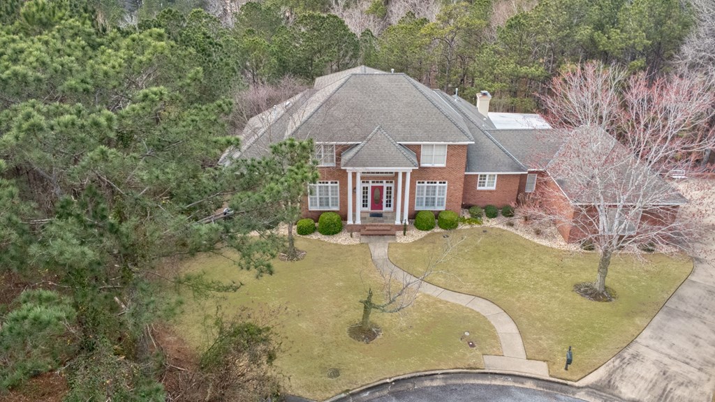 7633 Grand Ridge Road Columbus, GA 31904 - Photo 10 of 61 a view of a house with pool and trees in the background