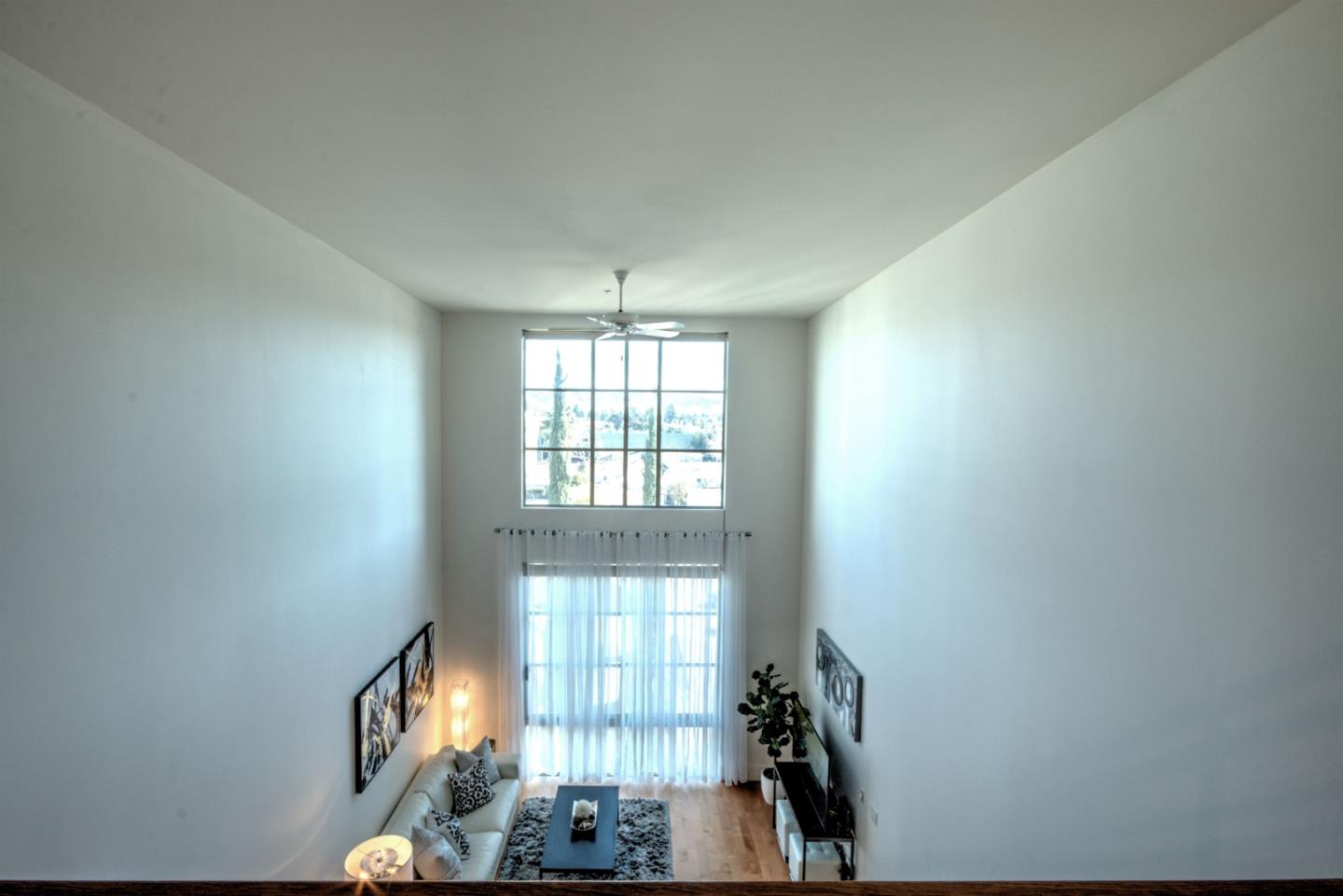 334 Santana Row, Unit 304 San Jose, CA 95128 - Photo 11 of 18 a view of entryway and hall with wooden floor