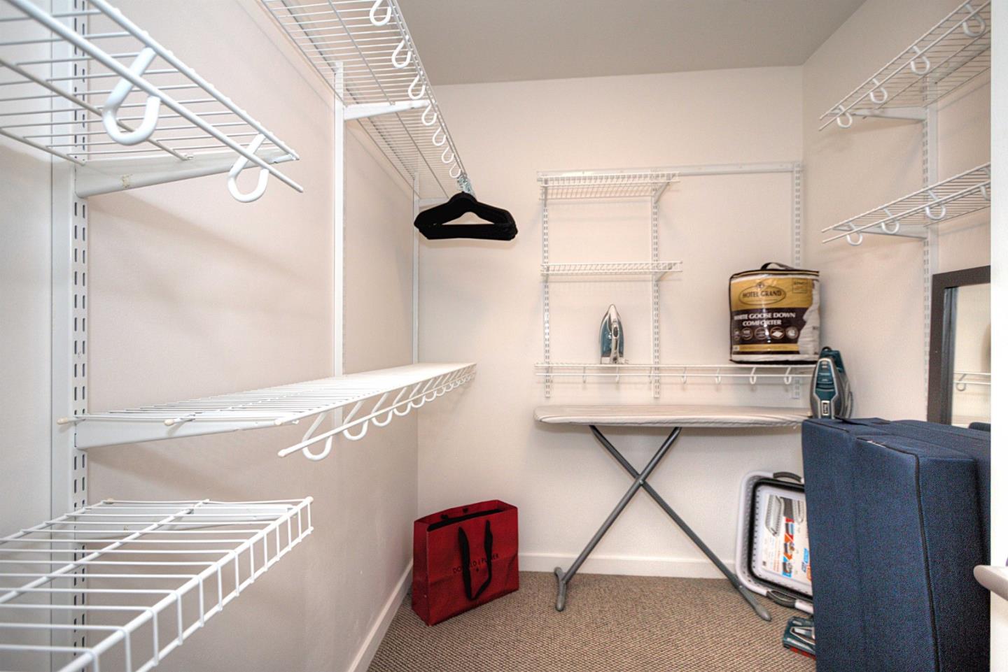 334 Santana Row, Unit 304 San Jose, CA 95128 - Photo 16 of 18 a bathroom with a sink and a mirror