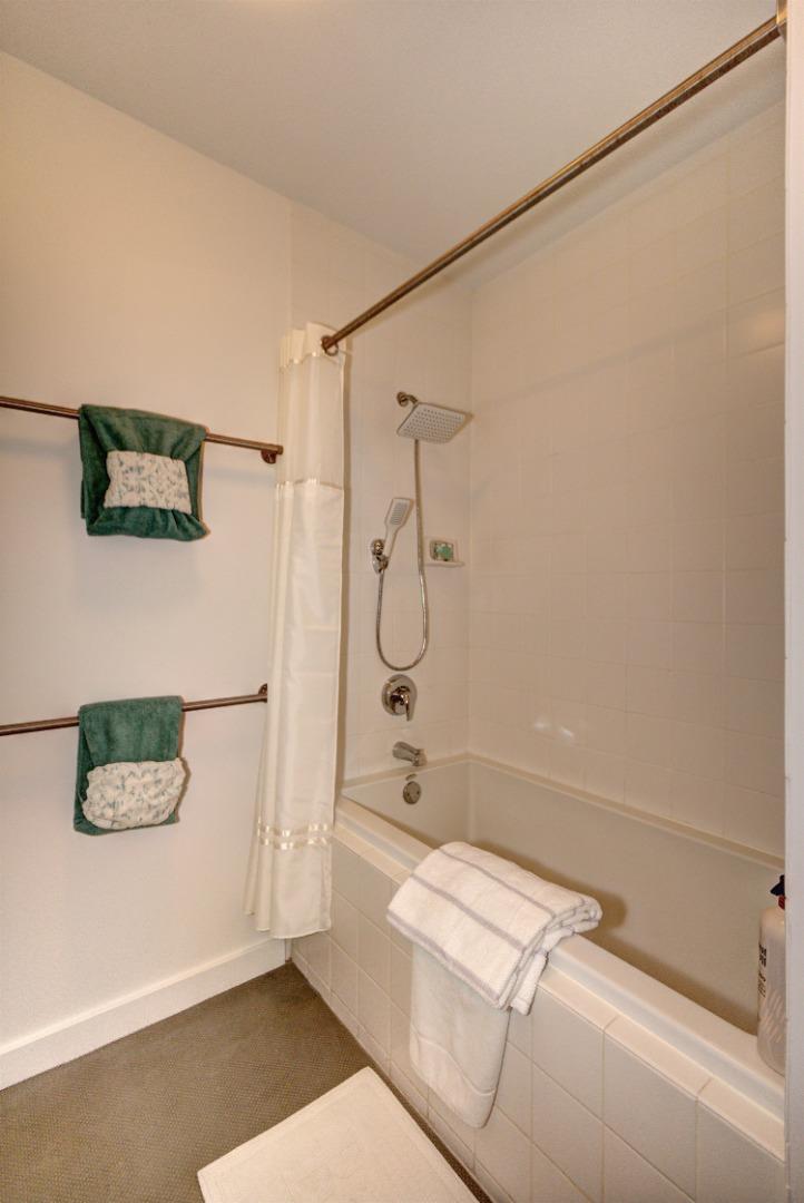 334 Santana Row, Unit 304 San Jose, CA 95128 - Photo 18 of 18 a bathroom with a shower and a toilet