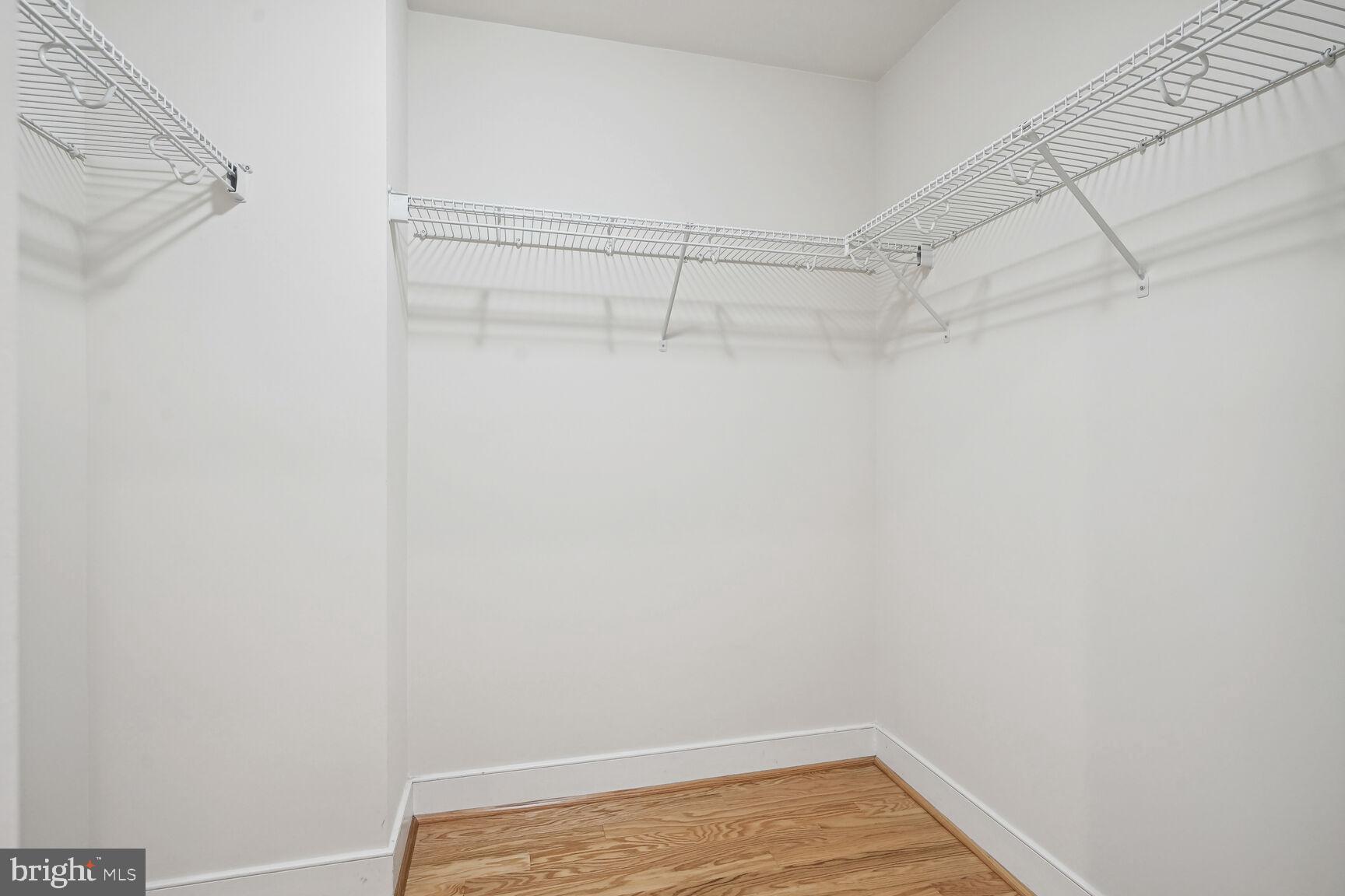 2425 L Street Northwest, Unit 637 Washington, DC 20037 - Photo 14 of 24 a view of a room with racks on the wall