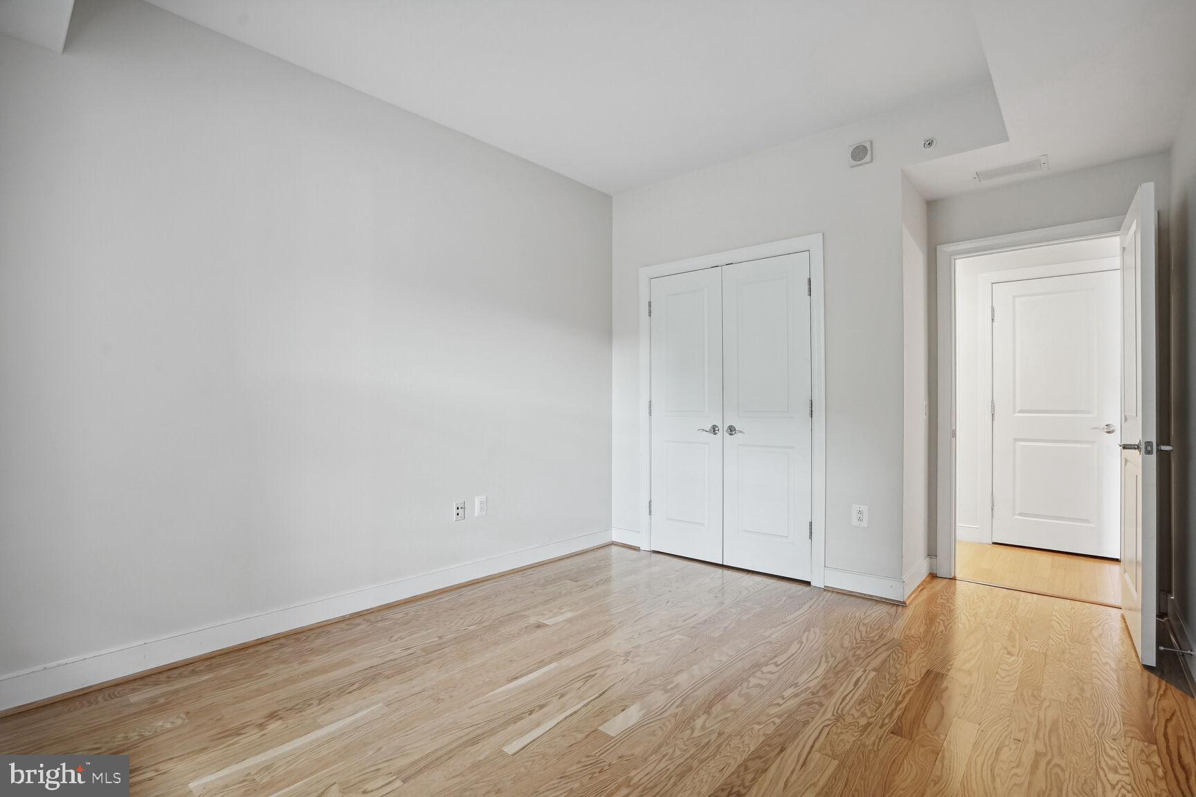 2425 L Street Northwest, Unit 637 Washington, DC 20037 - Photo 16 of 24 a view of an empty room and wooden floor