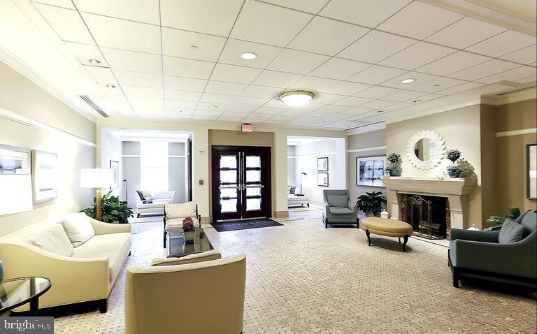 2425 L Street Northwest, Unit 637 Washington, DC 20037 - Photo 22 of 24 a living room with furniture and a fireplace