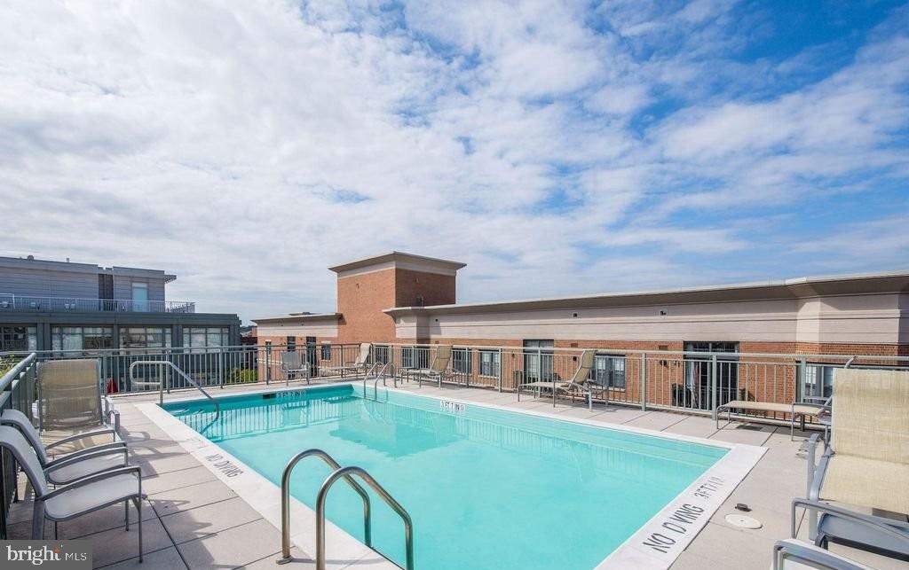 2425 L Street Northwest, Unit 637 Washington, DC 20037 - Photo 24 of 24 an aerial view of a house with swimming pool yard and furniture