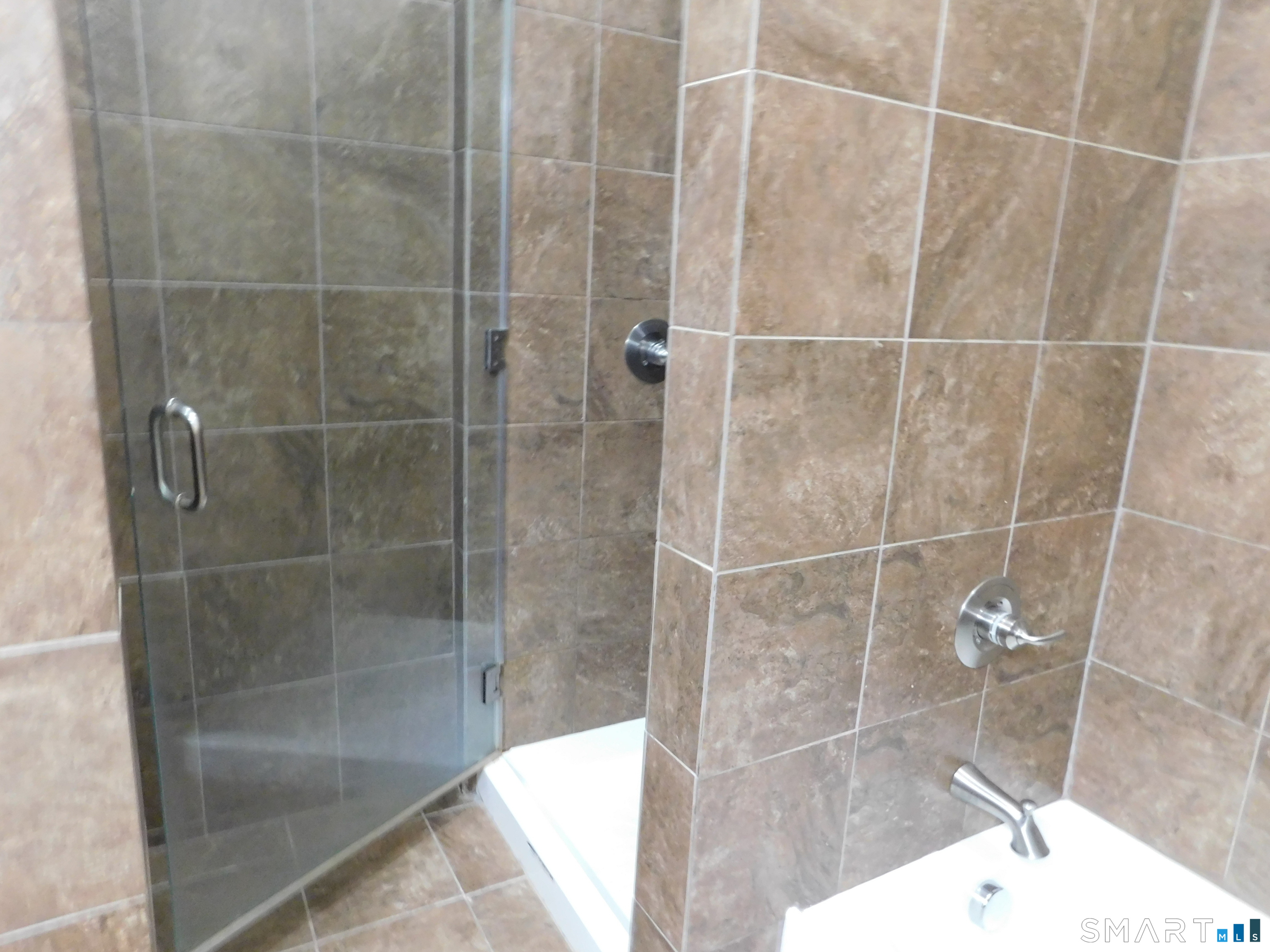 153 Bank Street, Unit 203 New London, CT 06320 - Photo 8 of 10 a bathroom with a shower
