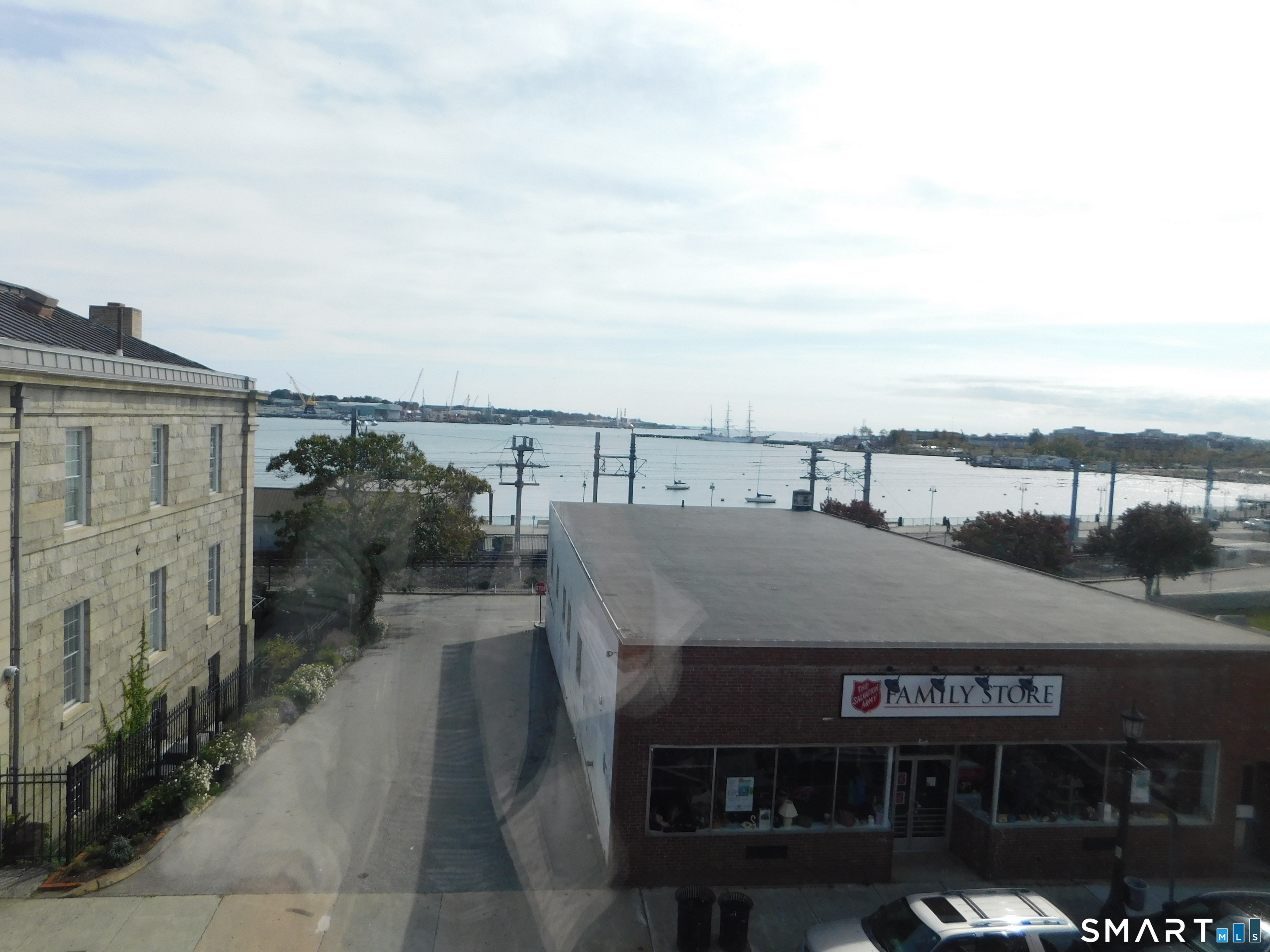 153 Bank Street, Unit 203 New London, CT 06320 - Photo 9 of 10 a view of houses with sky view